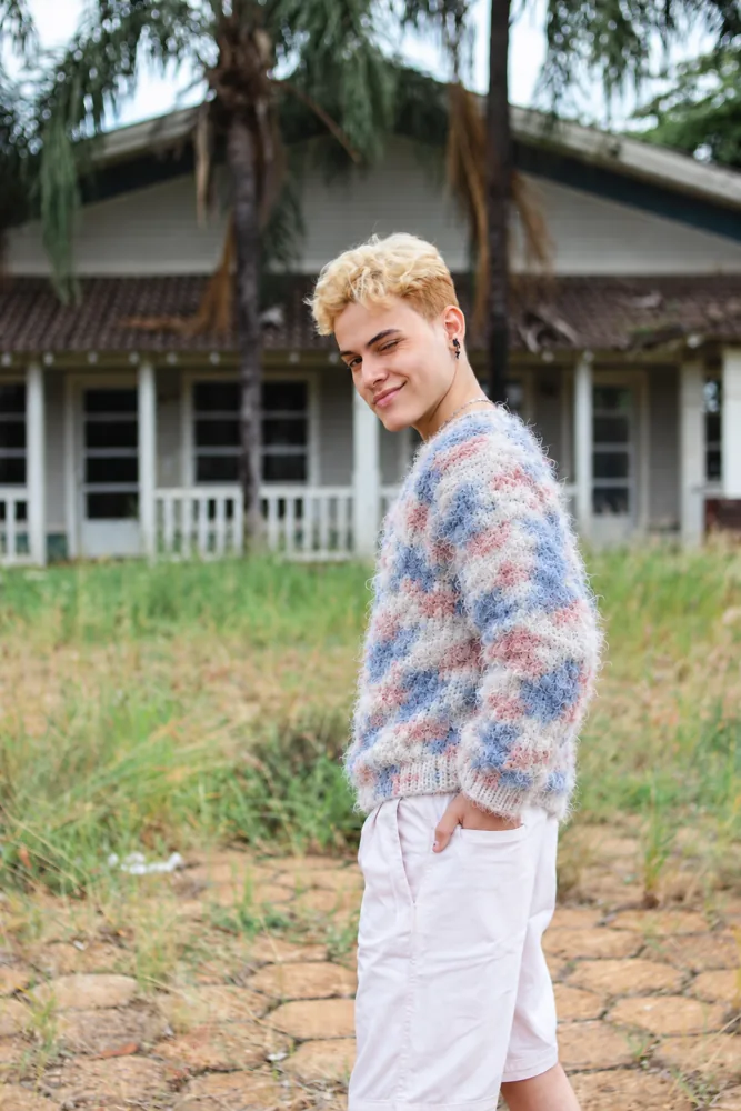 Model wearing the colourful It’s So Fluffy crochet pullover